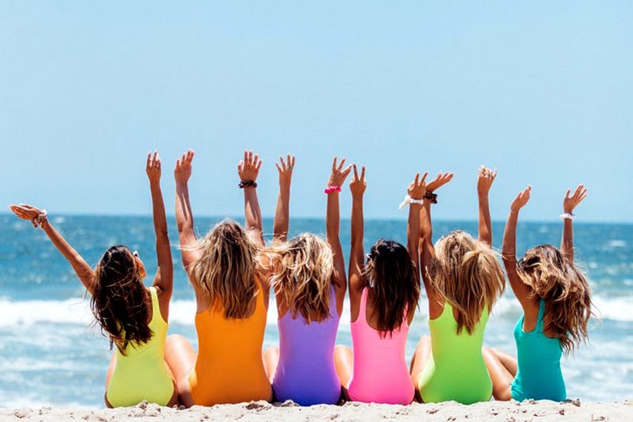 a group of girls on the sea beach