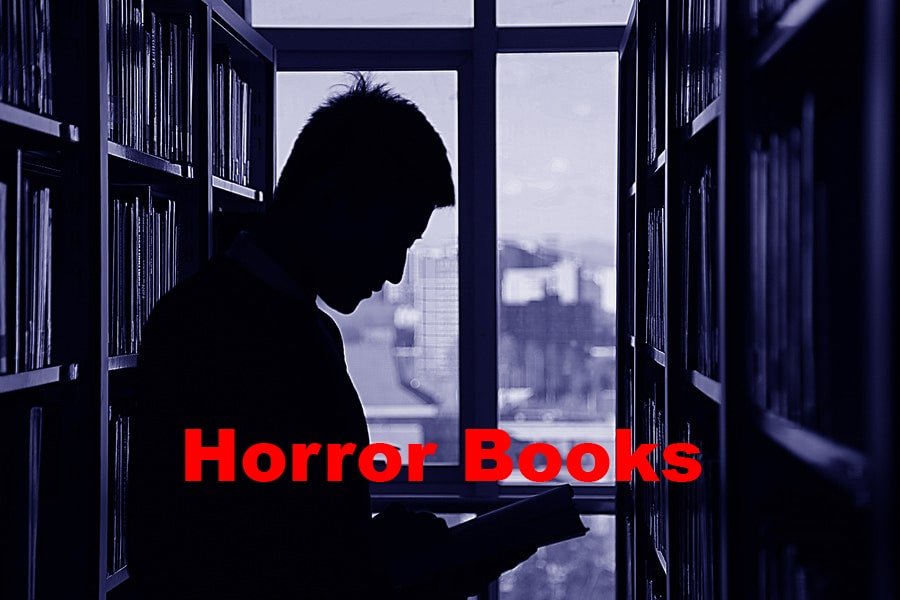 a man reading horror book
